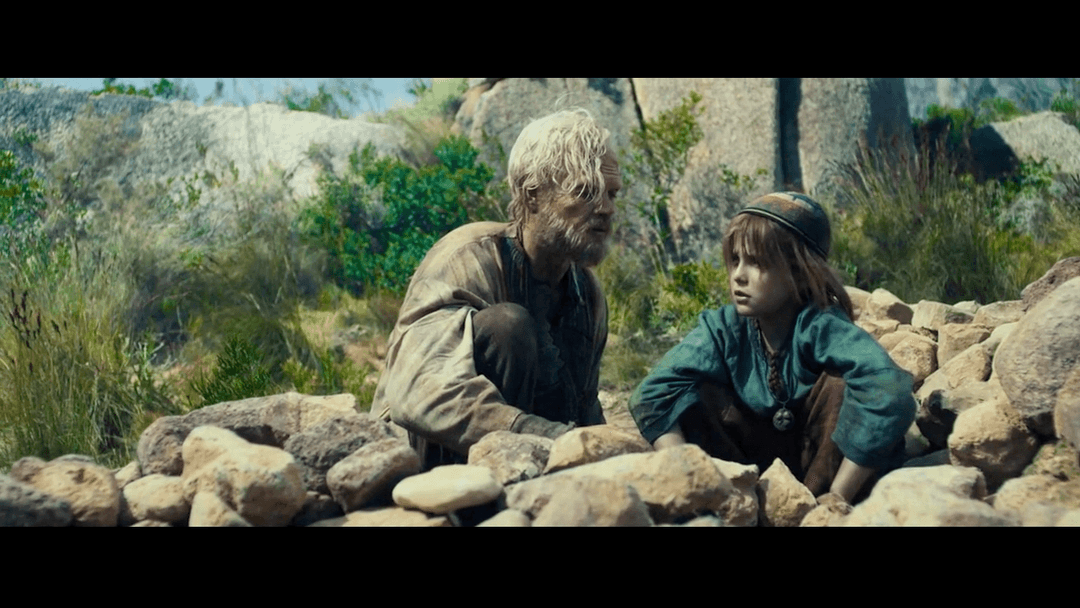 Grandfather talking to his grandson
